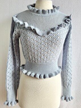 1970s-Inspired Pale Blue Ruffled Knit Pullover Sweater